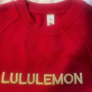 Lululemon Athletica Red Top with Gold Logo